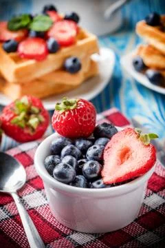 Waffles with berries. Stock Photos
