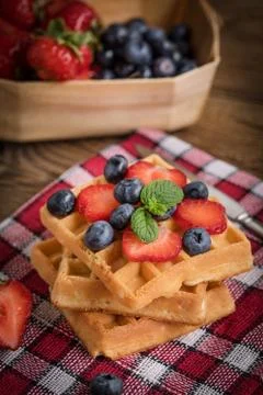 Waffles with berries. Stock Photos