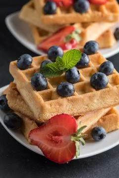 Waffles with berries. Stock Photos
