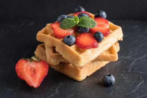 Waffles with berries. Stock Photos