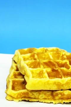 Waffles on blue background Stock Photos