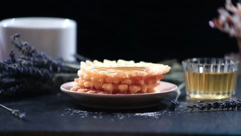 Waffles dripping honey on a dark background, close-up Stock Footage 137789502