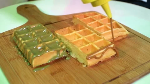 Waffles Drizzled with Sauces Stock Footage 318303227