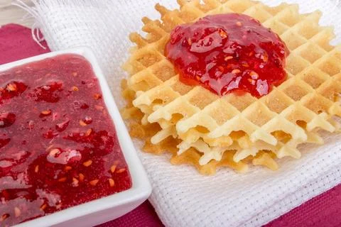 Waffles with raspberries jam Stock Photos