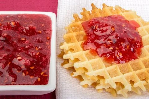 Waffles with raspberries jam Stock Photos