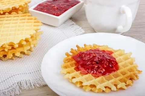 Waffles with raspberries jam Stock Photos