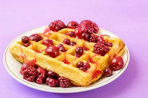 Waffles with red berries Stock Photos
