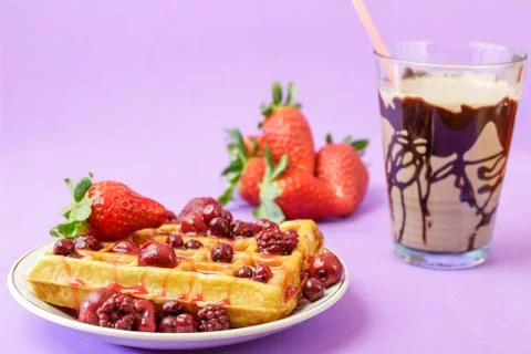 Waffles with red berries Stock Photos