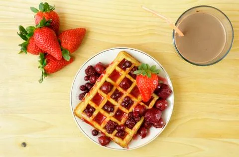 Waffles with red berries Stock Photos