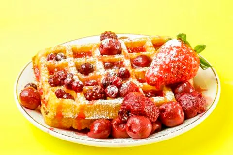 Waffles with red berries Stock Photos