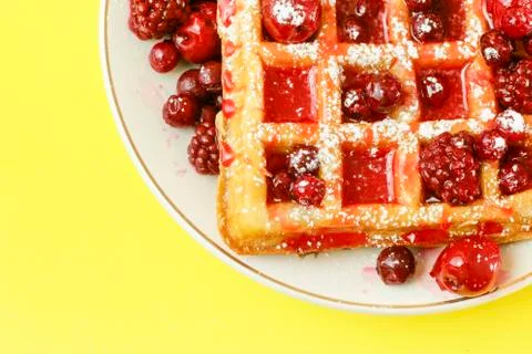 Waffles with red berries Stock Photos