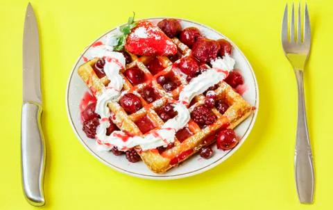 Waffles with red berries Stock Photos