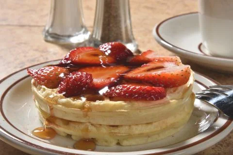 Waffles with strawberries Stock Photos