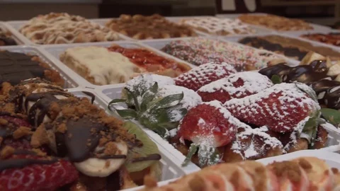 Waffles with toppings in belgium Stock Footage 129257088
