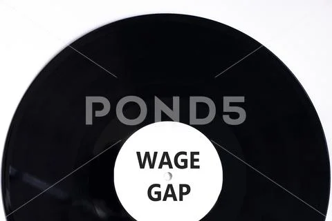 Wage gap symbol. Concept words Wage gap on beautiful black vinyl disk ...