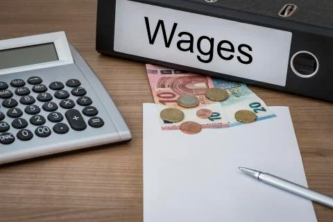Wages written on a binder Stock Photos