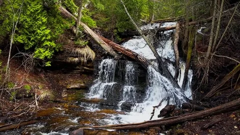 Wagner Falls flowing through forest at Pictured Rocks National Lakeshore Stock Footage 308958594