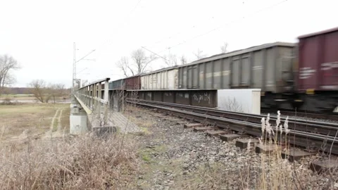 The wagon train finally moves over the bridge Stock Footage 300369662