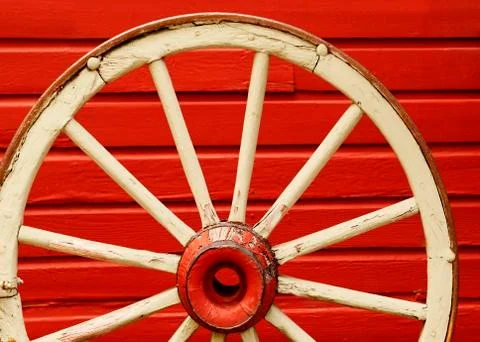 Wagon Wheel by Red Wall Stock Photos
