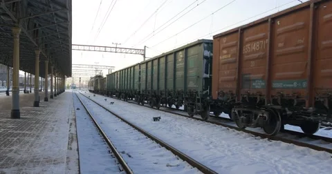 Wagons of Fraight Train are Driven Foreward Inscription Abbreviation in Russian Stock Footage 59544048
