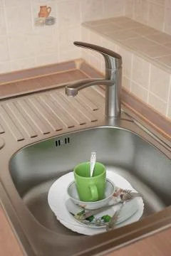 Wahsing dishes in the kitchen Stock Photos