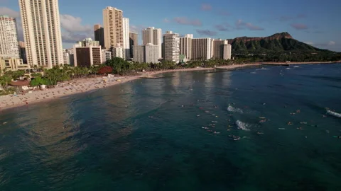 Waikiki drone camera tilt down to sufers with diamond head in background Stock Footage 170231352
