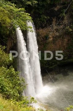 Wailua Falls in Hawaiian island of Kauai Stock Photos