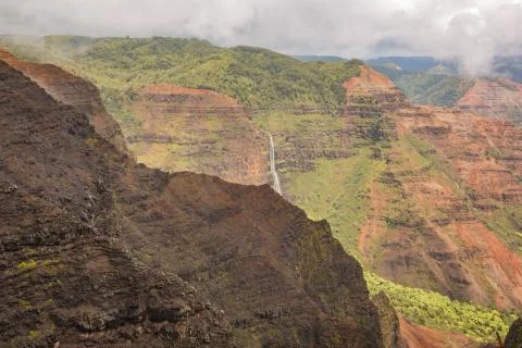 Waimea Falls seen through the clouds Stock Photos
