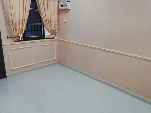 Wainscoting setup with wood panel and laser line in interior space Stock-Fotos