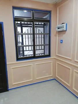 Wainscoting setup with wood panel and laser line in interior space Stock-Fotos