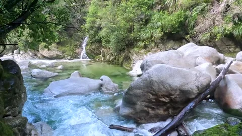 Wainui Falls: A Stunning Waterfall Cascading Through Rocks and Lush Native .. Stock Footage 286765636
