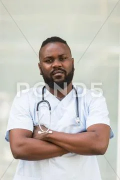 Waist Up Portrait Of African American Doctor With Crossed Arms