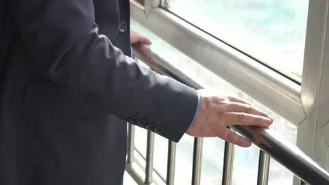 Wait and think in front of the window waiting for the failed man who is look Stock Footage 150487980