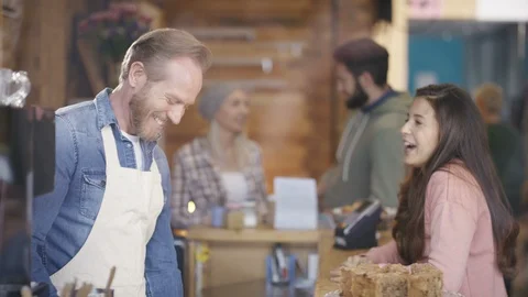 Waiter accepting payment from customer after serving coffee at counter Video stock 108015116