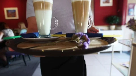 The waiter brings coffee to order to the table Stock Footage 81160118