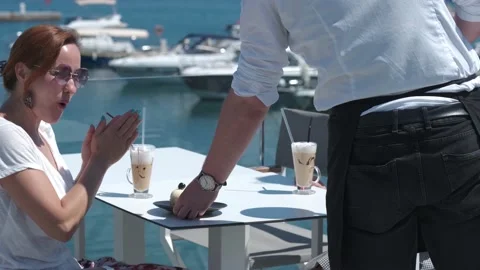 Waiter brings the order to the tourists Stock Footage 154709652