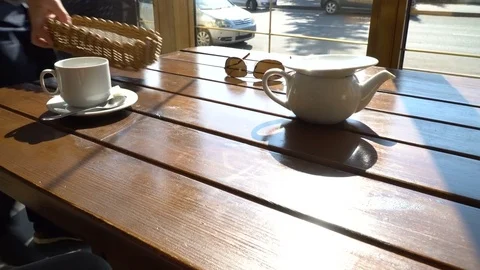 Waiter in cafe restaurant serving a table 4k Stock Footage 80788727