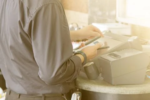 Waiter at the checkout Stock Photos