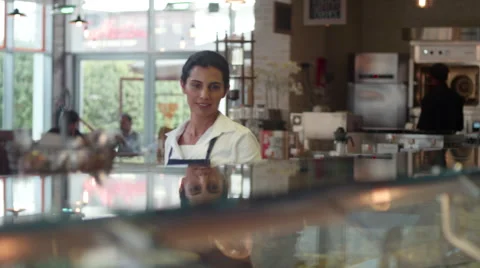 Waiter cleaning cafe counter. Stock Footage 64098659