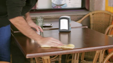 Waiter cleaning a table at restaurant Stock Footage 35404460