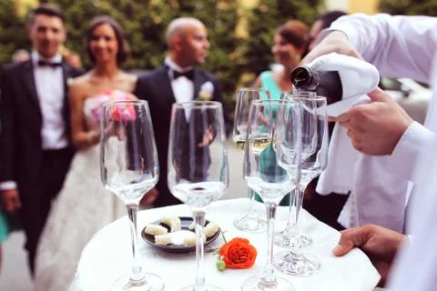 Waiter with glasses of champagne Stock Photos