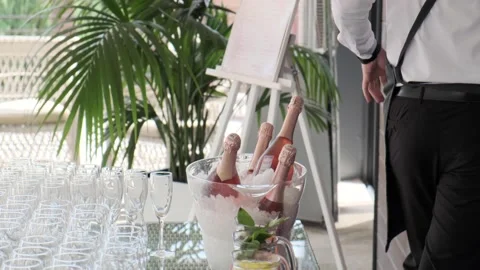 The waiter leaves the bottles on the table Stock Footage 136821117