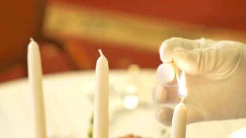 Waiter lit candles on the table Stock Footage 71467137