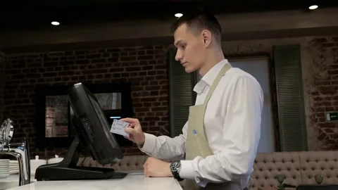 The waiter makes an order on the computer Video stock 199565787