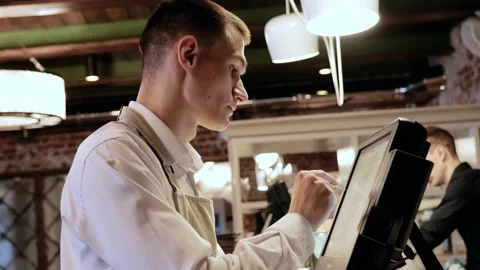 The waiter makes an order on the computer Video stock 212268420