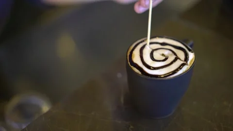Waiter making shape on latte Stock Footage 167587907