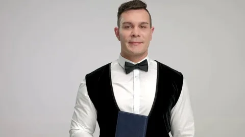 Waiter with a menu and a towel Stock Footage