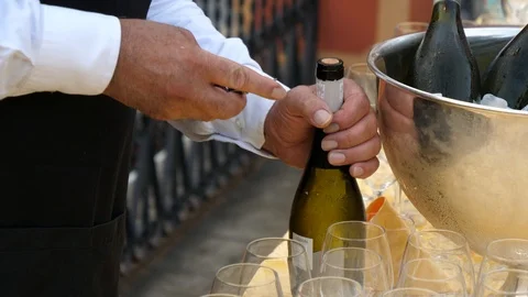 Waiter opening a wine bottle  Stock Footage 95779765