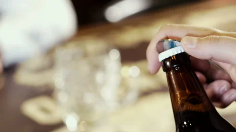 The waiter opens a bottle of beer Stock Footage 101750981