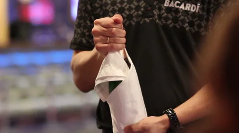 Waiter opens bottle of champagne Stock Footage 61854590